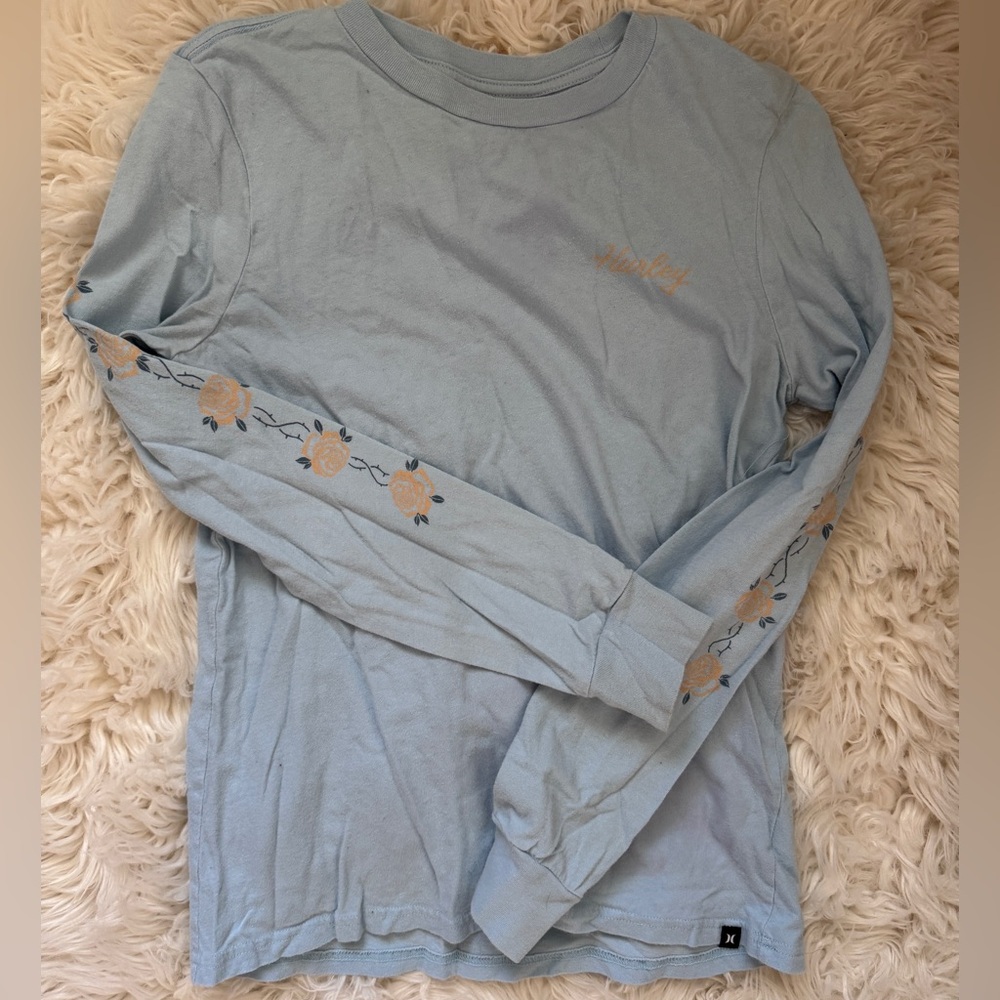 hurley long sleeve size small. blue with pretty floral on the arms. hardly worn